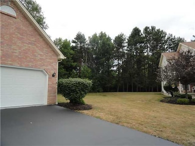 Exterior Front. Lots of green space and trees next