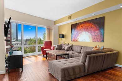 Wide-open living and dining with gorgeous tree-lined views.