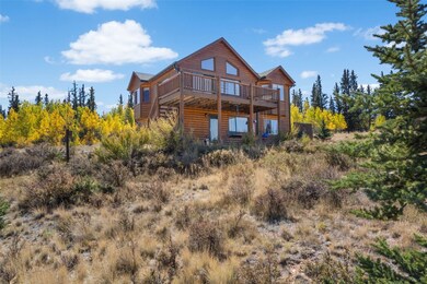 Rear view of property with a deck