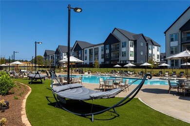 View of pool featuring a patio area and a yard