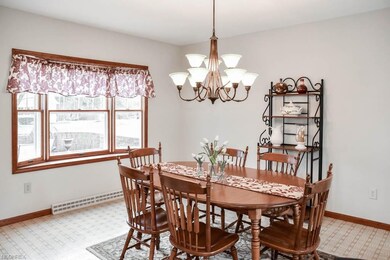 Formal dining room with a bay window.