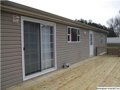 Two doors to deck, one from kitchen and another from the laundry room.