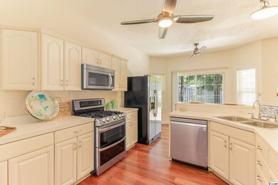 Kitchen features 2 ceiling fans, 1 in the kitchen 