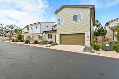 View of front of home with an attached garage, co
