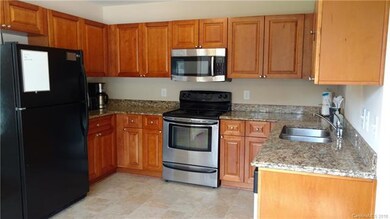 Kitchen has granite counters & SS appliances