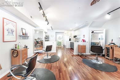 Living area with visible vents, track lighting, an