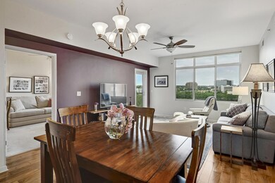 Dining space featuring a ceiling fan, wood-type f