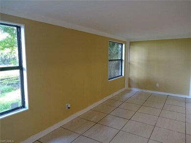 THIS IS THE PERMITTED DEN WHICH WAS AN ADDITION SEVERAL YEARS AGO.    LOOKS OUT INTO THE FRONT YARD.