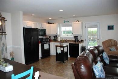Open floor plan with view of back yard