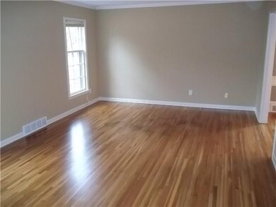 Seperate living room with fresh paint & hardwood f