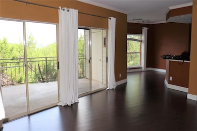 Spare room featuring baseboards, ornamental moldi