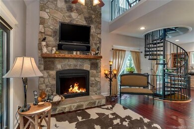 2 story gas fireplace with hand carved mantle