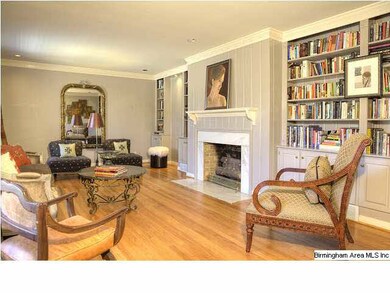 Spacious living room with fireplace and built-in b