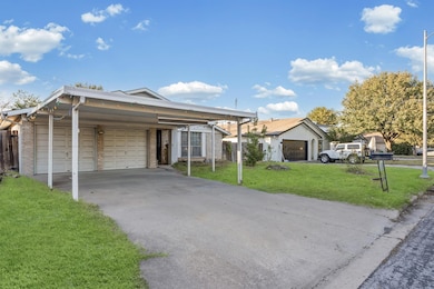 Ranch-style home featuring a front lawn, brick siding, a 2 car garage, and a 2 car carport. House For Sale: 6300 Libyan Dr., Austin, Tx 78745. Travis County.