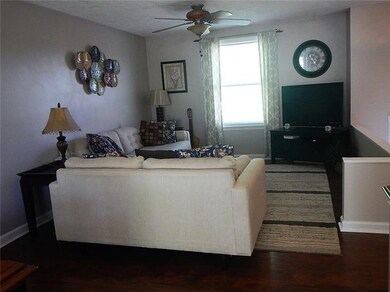 The living room has been freshly painted and is eq