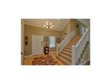 Inviting entry has new light fixture and extra wid