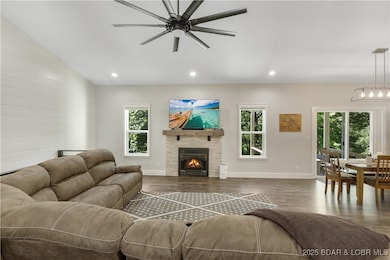 The open floor plan is highlighted by natural light spilling in the from the tranquil backyard.