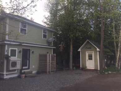 Outdoor shower on house and 8x12 shed
