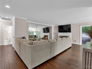 Living room with dark hardwood / wood-style floori