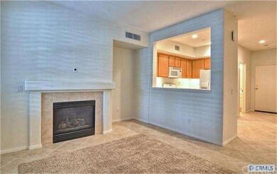 Open concept living room with cozy fireplace