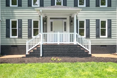 Doorway to property featuring crawl space and roof