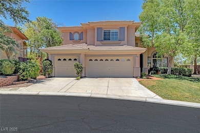 View of front of property with a tile roof, driveway, stucco siding, a front lawn, and a garage