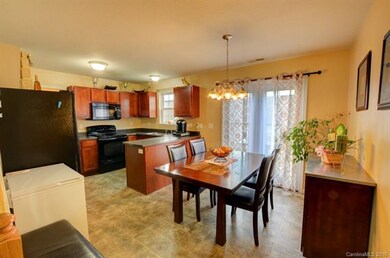 Dining room w/ doors that lead to rear patio