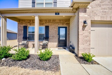 Property entrance with brick siding and covered po