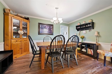 Roomy dining room with easy access to kitchen and