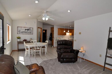 Living, dining and kitchen create a charming open floor plan feel.