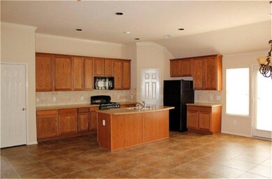 Ceramic tile floors throughout the family room, kitchen and dining area.