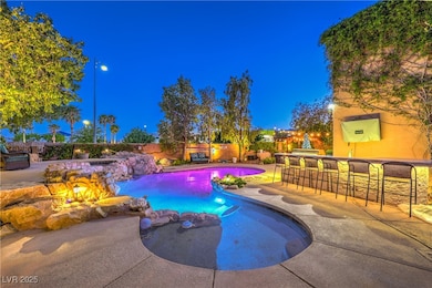 Pool at twilight with a fenced backyard and a pati