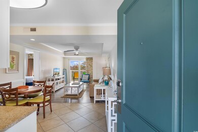 Interior space with crown molding, light hardwood 