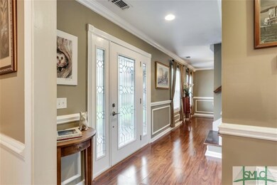Foyer Entrance ~ Tons of Trim Throughout This Home