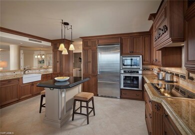 Kitchen with pendant lighting, sink, light tile patterned floors, and built in appliances