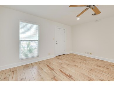 Unfurnished room featuring wood-type flooring, ce