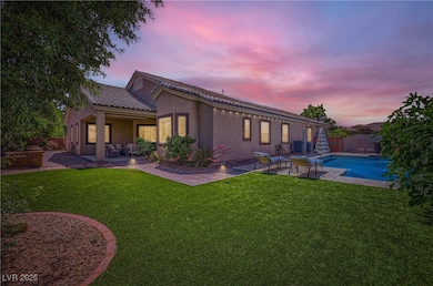 Back of house at dusk featuring a patio area, cool