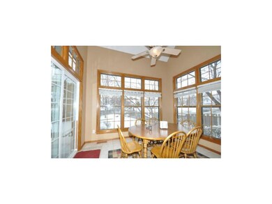 Bright and sunny eating area surrounded by windows