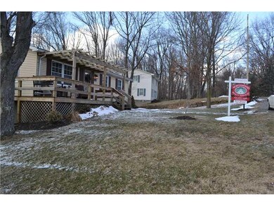 Exterior Front. Level front yard with access to dr