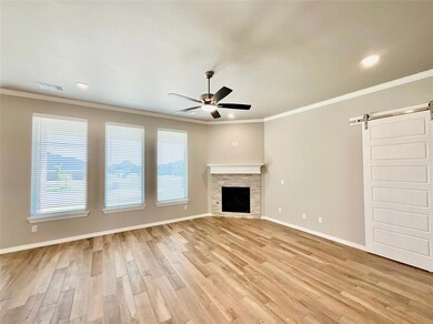 Unfurnished living room with ornamental molding, l