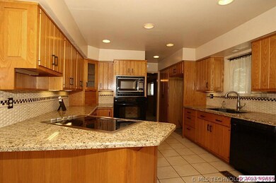 The kitchen has been updated with granite countert