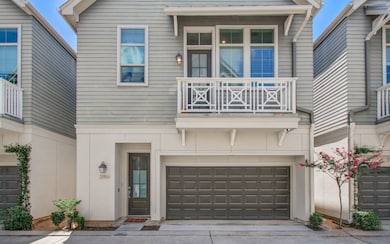 Modern home with 2-car garage and balcony