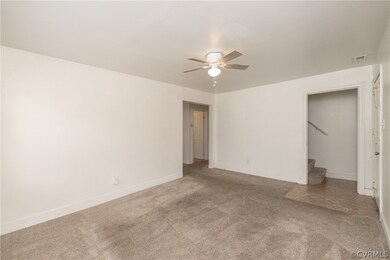 Unfurnished bedroom with a closet, ceiling fan, an