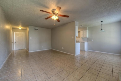 Unfurnished living room with a textured ceiling, 