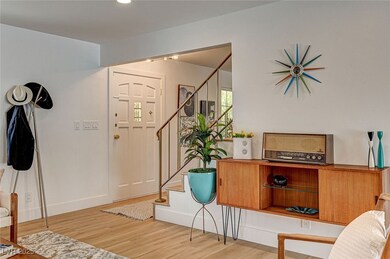 Entry with stairway to second story, original wrou