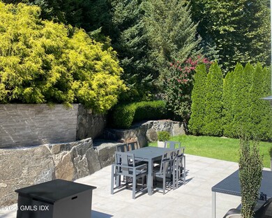 Lush backyard with Evergreen Plantings