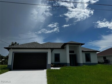 Prairie-style home with stucco siding, a garage, driveway, a front yard, and roof with shingles