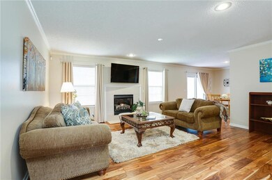 Large living room with gas fireplace insert.