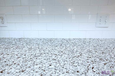 Subway tile backsplash with slab granite