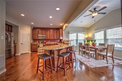 KITCHEN:  Gleaming hardwood floors, granite counte